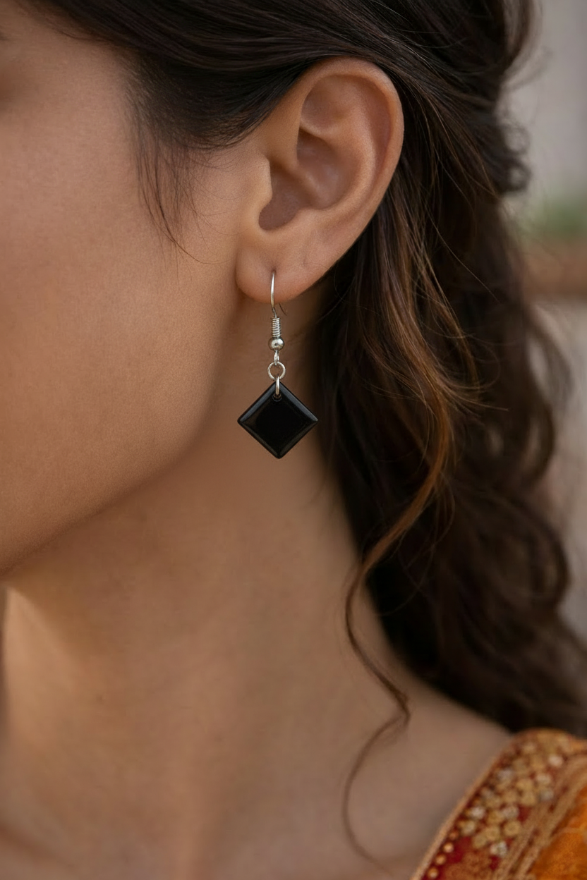 Model with Small Black Resin Earrings